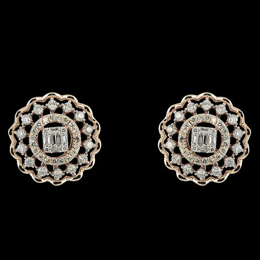 Elegant round earrings with a central baguette diamond surrounded by a scalloped diamond halo. A refined and timeless piece from jnjbymadhuri.
