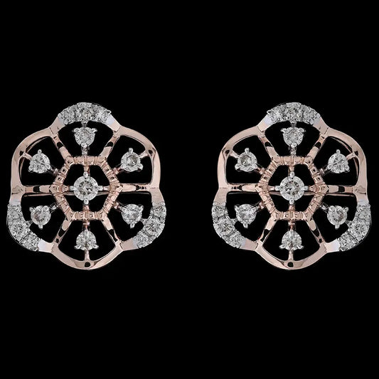Intricately designed floral motif earrings in rose gold, highlighted with sparkling white stones arranged in a symmetrical pattern. These artistic studs by jnjbymadhuri bring a touch of tradition with contemporary elegance.

