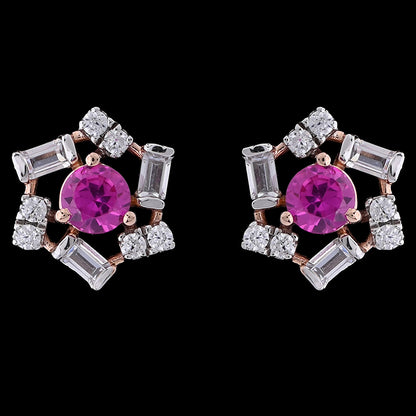 These floral-inspired earrings by jnjbymadhuri feature vivid fuchsia center stones surrounded by shimmering baguette and round-cut crystals in a delicate rose gold setting. A perfect blend of bold color and refined sparkle, ideal for both festive occasions and elegant everyday wear.
