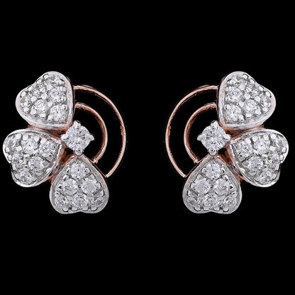 Charming clover-inspired earrings featuring four heart-shaped petals encrusted with diamonds on a rose gold base. A delicate and romantic creation by jnjbymadhuri.
