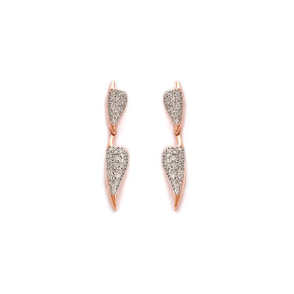 Contemporary double-drop earrings from jnjbymadhuri, crafted in rose gold and encrusted with shimmering white stones for a sleek modern look. Elevate your style with these versatile, elegant pieces by jnjbymadhuri.
