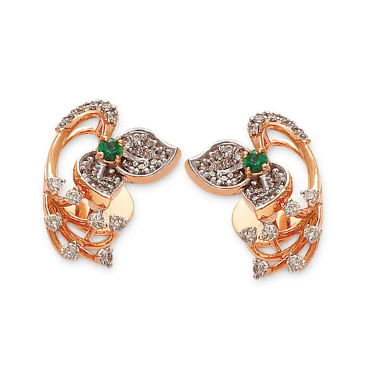 Elegant floral-inspired rose gold earrings adorned with sparkling white stones and a touch of green, perfect for festive or formal occasions. Crafted with intricate detail by jnjbymadhuri, these earrings embody timeless charm and sophistication.
