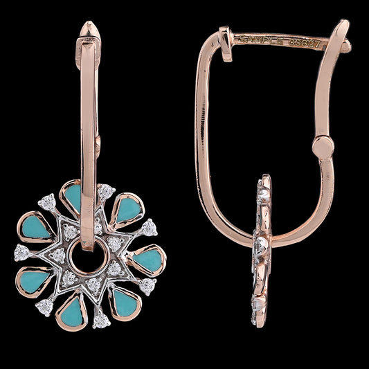 Elegant turquoise enamel floral earrings by jnjbymadhuri, set in a refined rose gold hoop with delicate diamond accents. These intricately crafted jnjbymadhuri earrings blend tradition with a modern twist for a timeless look.
