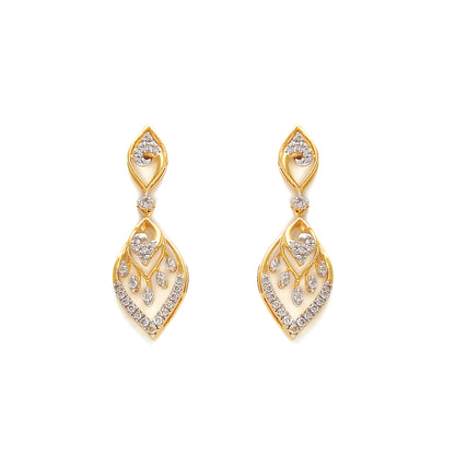 Delicate gold-toned earrings with intricate leaf-like diamond arrangements, offering timeless elegance. Crafted with finesse by jnjbymadhuri.

