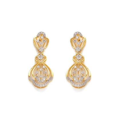 Graceful gold drop earrings adorned with intricate diamond accents in a floral-inspired design. A radiant statement piece from jnjbymadhuri.
