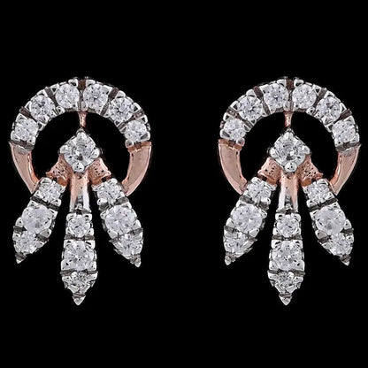 Dazzling rose gold stud earrings adorned with clustered diamonds in a radiant circular design. A luxurious creation by jnjbymadhuri.

