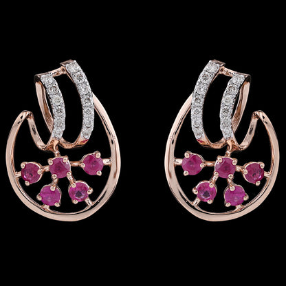 Rose gold earrings with dazzling diamond-studded curves and blooming pink floral gems, radiating charm and grace from jnjbymadhuri.
