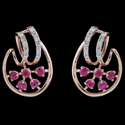 Rose gold earrings with dazzling diamond-studded curves and blooming pink floral gems, radiating charm and grace from jnjbymadhuri.
