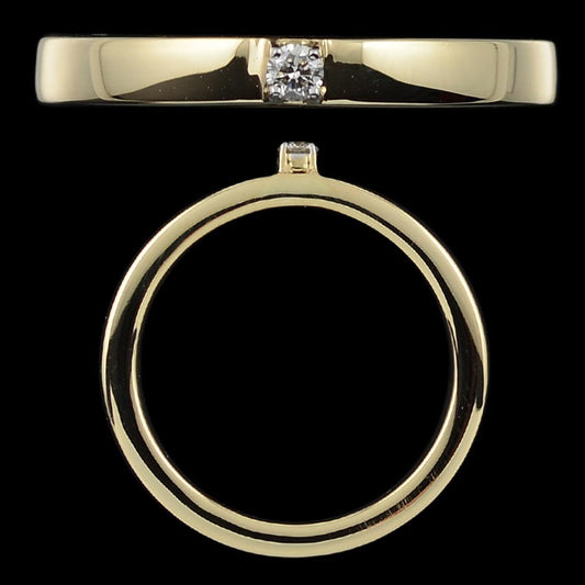 Bold and elegant, this gold band ring features a centrally set diamond with a polished finish for modern sophistication. A timeless design by jnjbymadhuri.