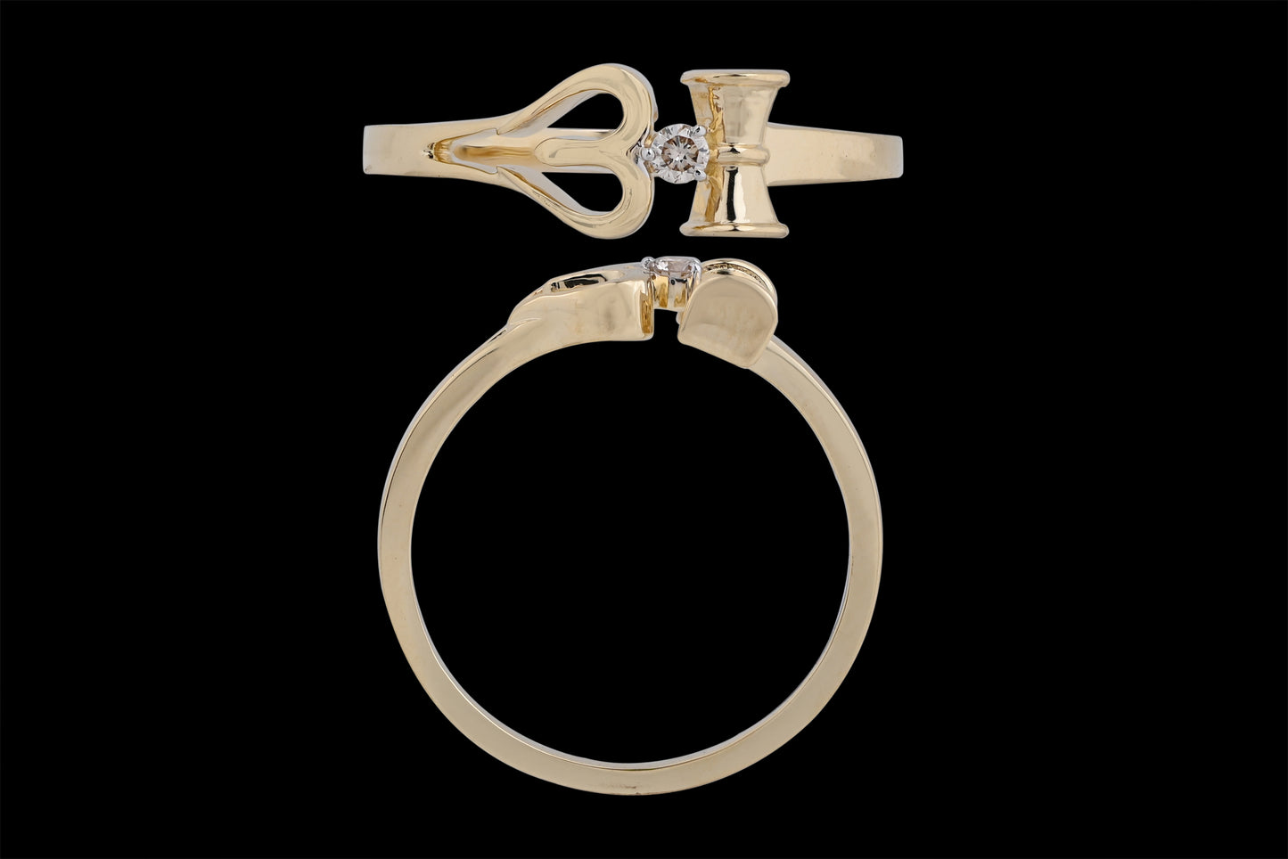 This is another view of the same distinctive gold ring, reinforcing its key design elements: the heart-shaped motif, vertical bar, and central diamond. The top-down and side angles clearly showcase the precision of the cut and symmetry, underlining its elegant yet symbolic appeal—an excellent representation of jnjbymadhuri's craftsmanship.
