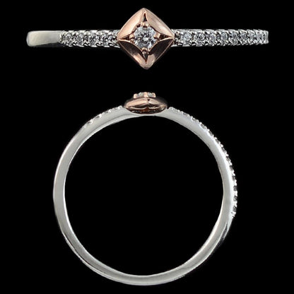 This elegant dual-tone ring by jnjbymadhuri features a sparkling central diamond in a rose gold square bezel, set on a slender silver band encrusted with tiny diamonds for extra brilliance.
