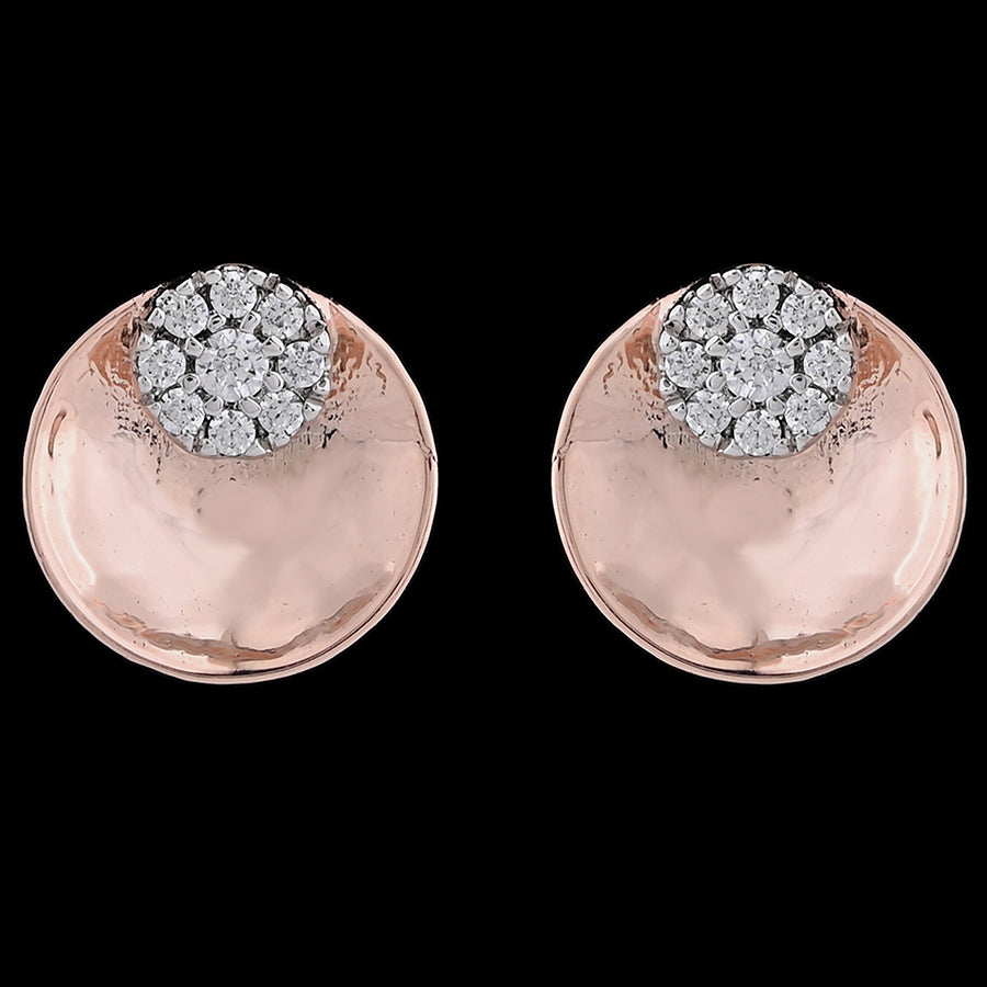 A close-up of rose gold stud earrings with a sparkling cluster of diamonds on top, set against a bold black background. Gracefully designed by jnjbymadhuri.

