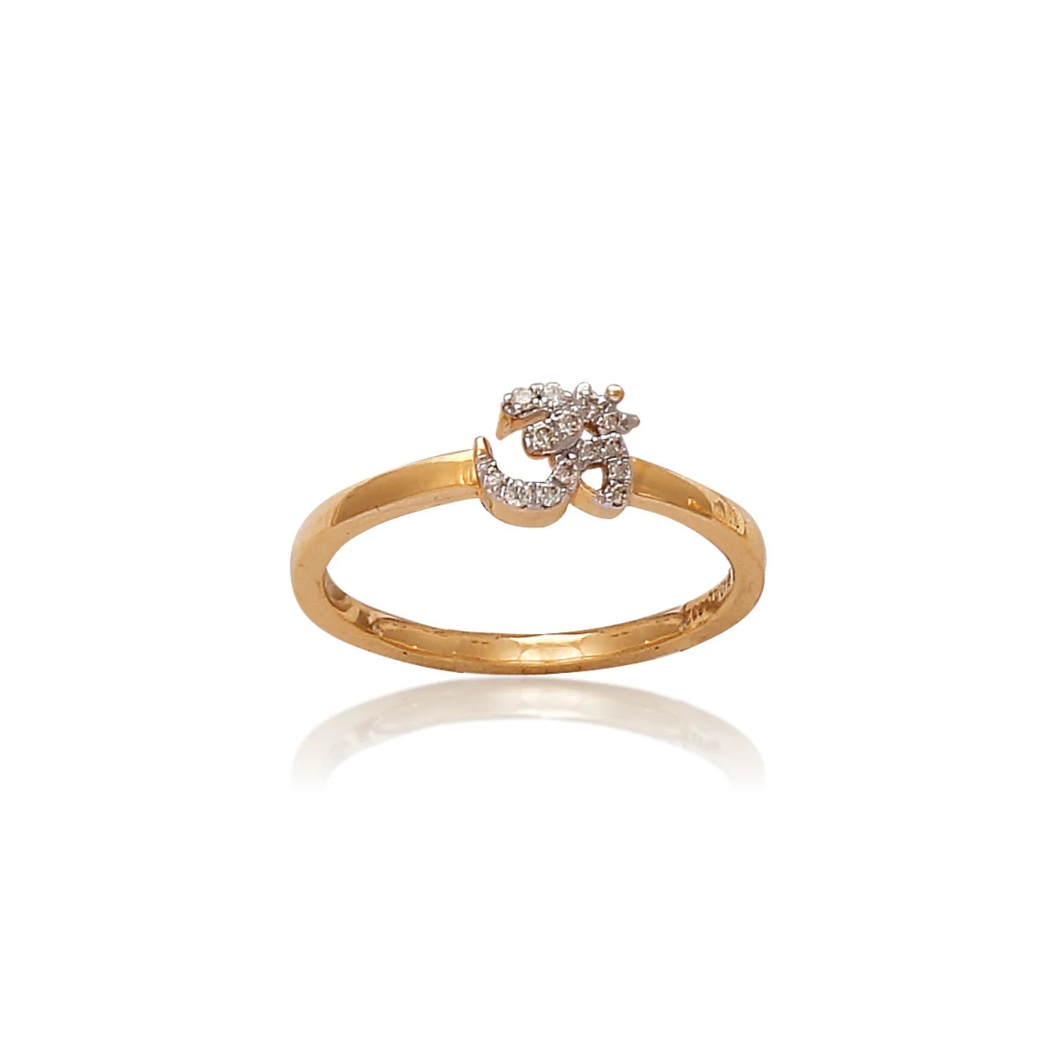 A gold ring featuring a finely detailed diamond-studded "Om" symbol at its center, reflecting spiritual elegance and minimalism, presented on a clean white background to enhance its brilliance and craftsmanship, from jnjbymadhuri.
